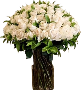 A flower vase of white flowers with greenery
