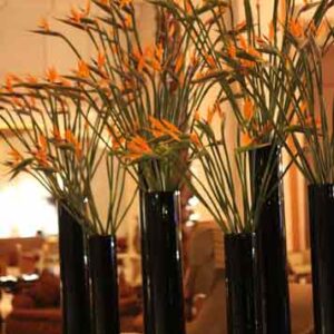 vase of bird flowers on table