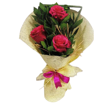 A small flower bouquet of 3 dark pink roses with green leaves and beige wrapping paper