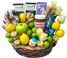 A gift basket of vegetables with chocolates and flowers