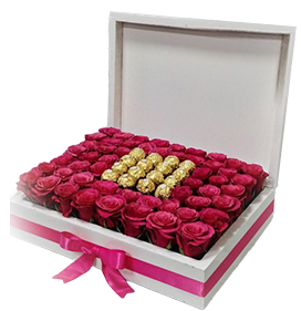 A flower box of fuchsia roses with chocolates