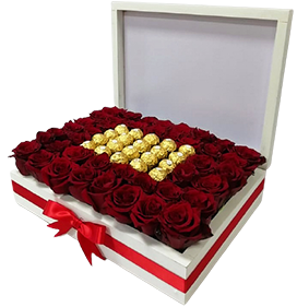 A flower box of red roses with chocolates