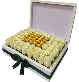 A flower box of white roses with chocolates