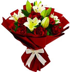 A flower bouquet of red roses with white lilies and greenery
