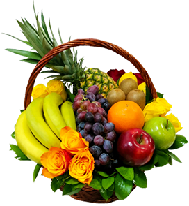 A gift basket of fruits with roses and greenery