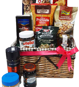 A gift basket of coffee, honey, sweets, with snacks and chocolates