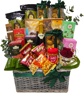 A gift basket of Eid cookies, with tea, coffee, sweets and snacks decorated with flowers and greenery