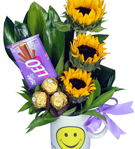 A smiley mug with sunflowers and chocolates