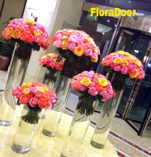 vase of mixed color flowers on table