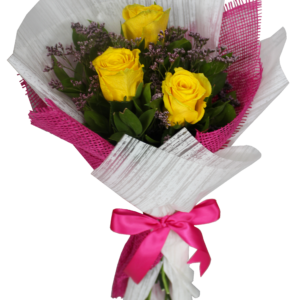 A small flower bouquet of 3 yellow roses with green leaves and white and pink wrapping paper