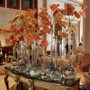 vase of orange flowers on table