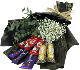A flower bouquet of white baby flowers with eucalyptus and chocolates