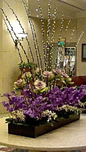vase of purple flowers on table