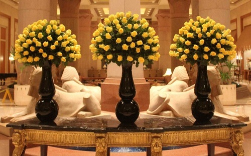 vase of yellow flowers on table