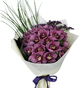 A flower bouquet of purple cymbidium orchids