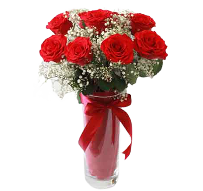 A flower vase of red roses and white baby flowers (Gypsophila)