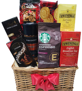 A gift basket of coffee, tea, cookies and chocolates