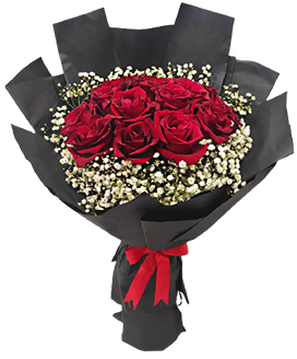 A flower bouquet of red roses with white baby flowers