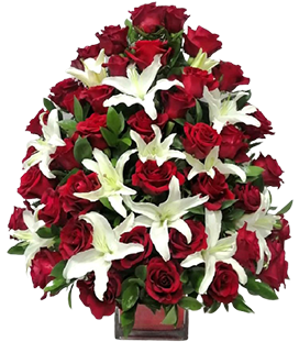 A flower vase with red roses and white lilies