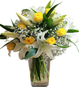 A flower vase of yellow roses and white lilies