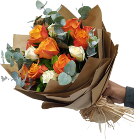 A flower bouquet of orange and white roses