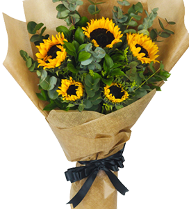 A flower bouquet of sunflowers with eucalyptus and beige wrapping