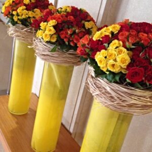 basket of yellow , red,orange flowers and greeny