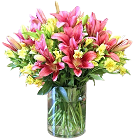 A flower vase of pink lilies with yellow alstroemeria with green leaves