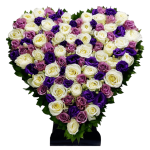 A heart shaped flower arrangement of white and purple roses with purple lisianthus and green leaves for delivery in Egypt